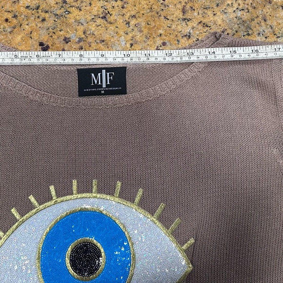 Moving Forward Tan Sweater with Blue and Gold Evil Eye Design - Picture 5 of 8